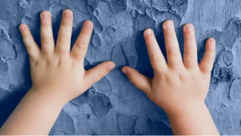 Baby hands on wall